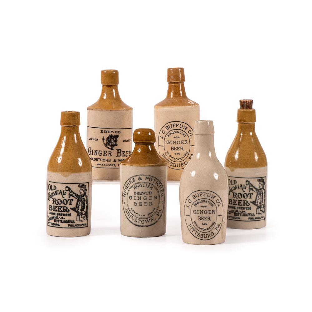 Six Pittsburgh Stoneware Ginger and Root Beer Bottles: Late 19th/Early 20th Century Height of largest 7 1/4 inches.