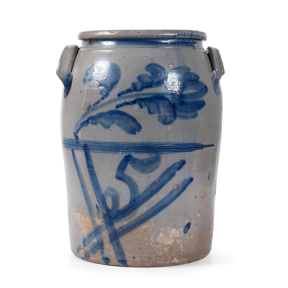 A Five Gallon Cobalt-Decorated Pennsylvania Stoneware: A Five Gallon Cobalt-Decorated Pennsylvania Stoneware Crock Western Pennsylvania, 19th Century unsigned, with applied lug handles, tooled rim and body, with large free-hand cobalt flower, 5 nested in
