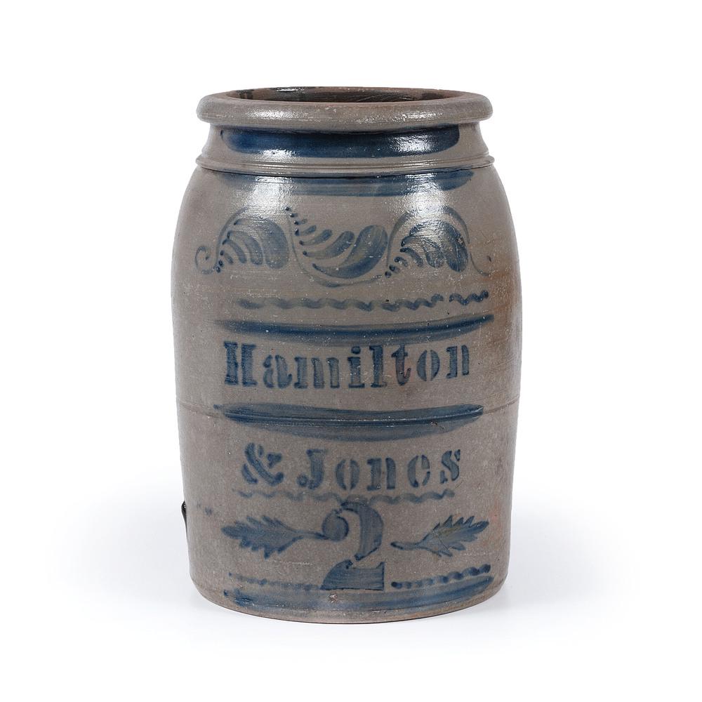 A Pennsylvania Two Gallon Stoneware Crock: Hamilton and Jones, Greensboro, Pennsylvania, Second Half 19th Century with tooled collar, free-hand cobalt stripes, squiggles and floral flourishes, with stenciled makers name and capacity mark flank