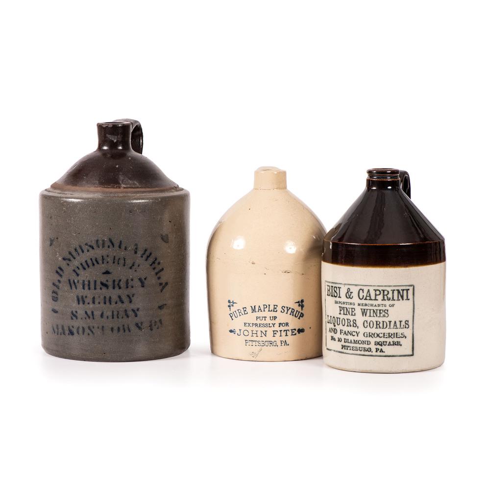 Three Pennsylvania Retailer: Late 19th/Early 20th Century including Bisi and Caprini, John Fite Pure Maple Syrup, and salt-glazed jug for W. and S.M. Gray, Masontown, Pennsylvania. Height of largest 10 1/2 inches.
