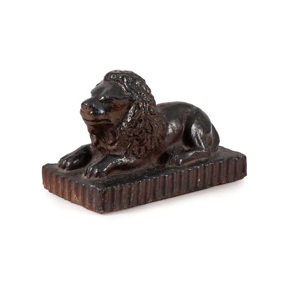 A Signed Ohio Sewer Tile Lion: Wadsworth, Ohio, 1929 a molded reclining lion on scalloped plinth, signed 2-10-29 LE Wadsworth, Ohio on underside. Height 6 x length 9 inches. While this form is commonly seen in Ohio collections