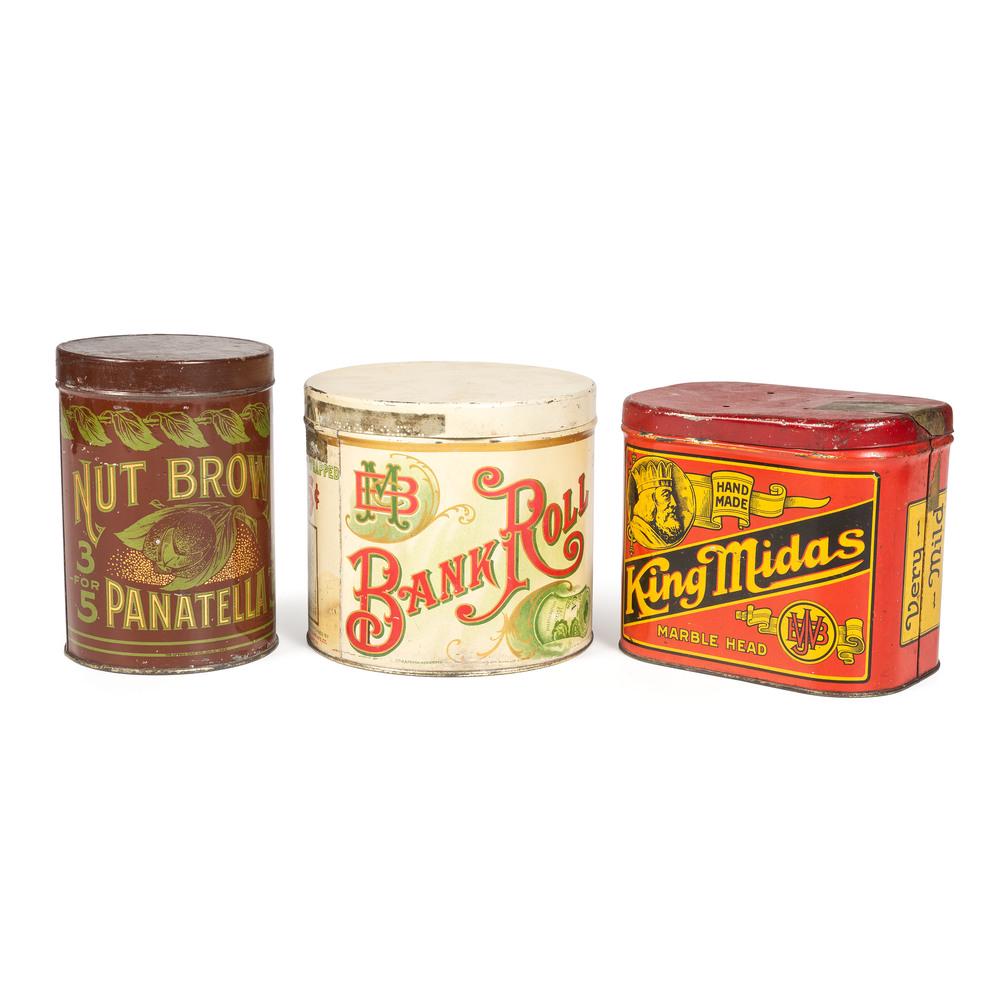 Three Cigar Tins: Late 19th/20th Century including King Midas, Nut Brown Panatella and Bank Roll. Height of largest 5 7/8 inches.