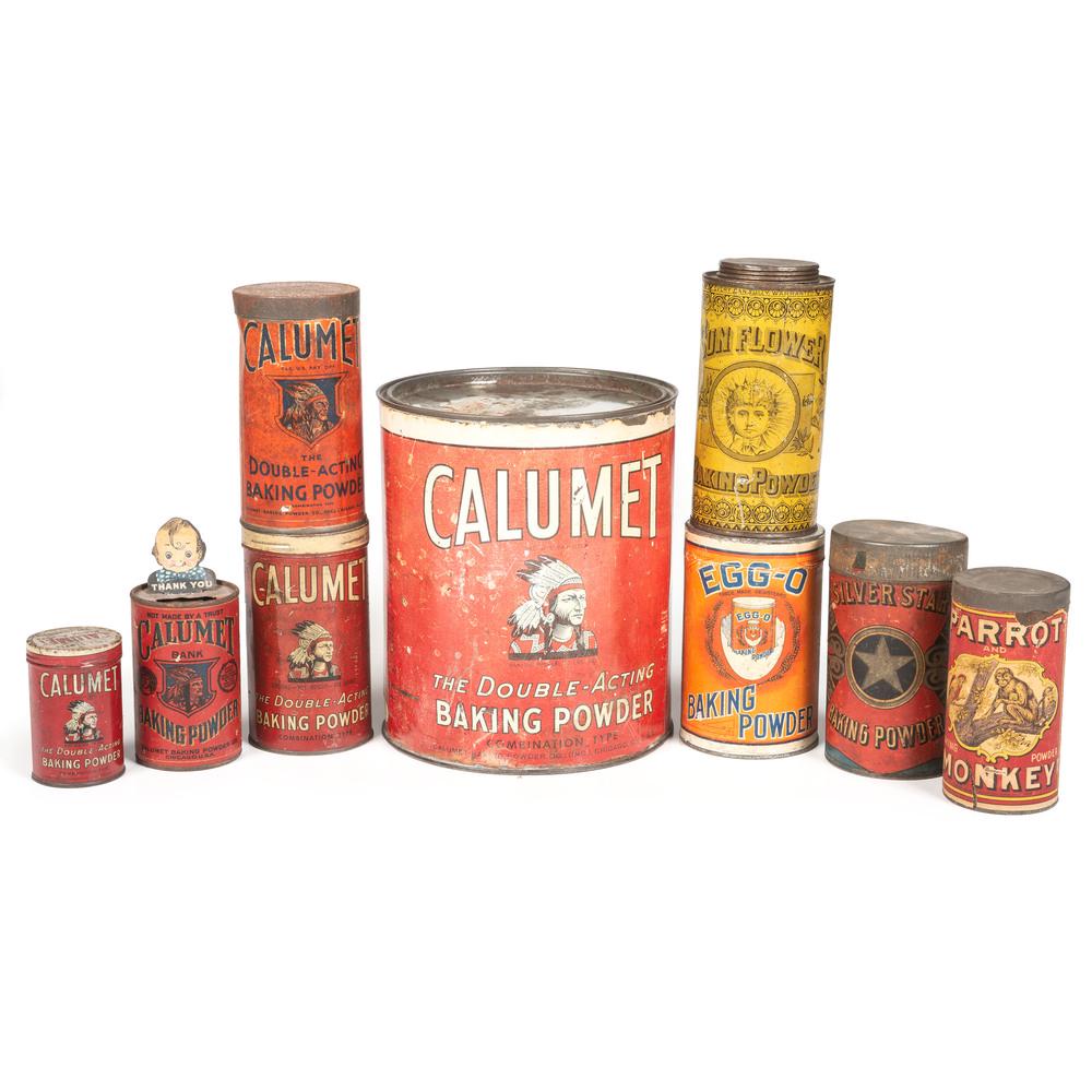 Nine Baking Powder Tins: 20th Century nine tins including four Calumet, one Calumet bank, and one each for Sunflower, EGG-O, Parrot and Silver Star brands. Height of largest 8 1/4 inches.