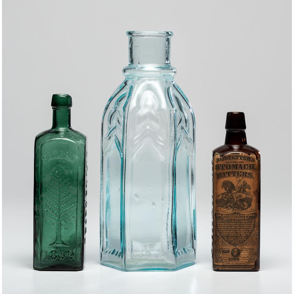 Three Pennsylvania Glass Advertising Bottles: Three Pennsylvania Glass Advertising Bottles American, 19th Century includes a magnum size ICC (Pittsburgh) cathedral pickle jar, an L.O.C. Wishart's (Philadelphia) cordial bottle and a Hostetters's (