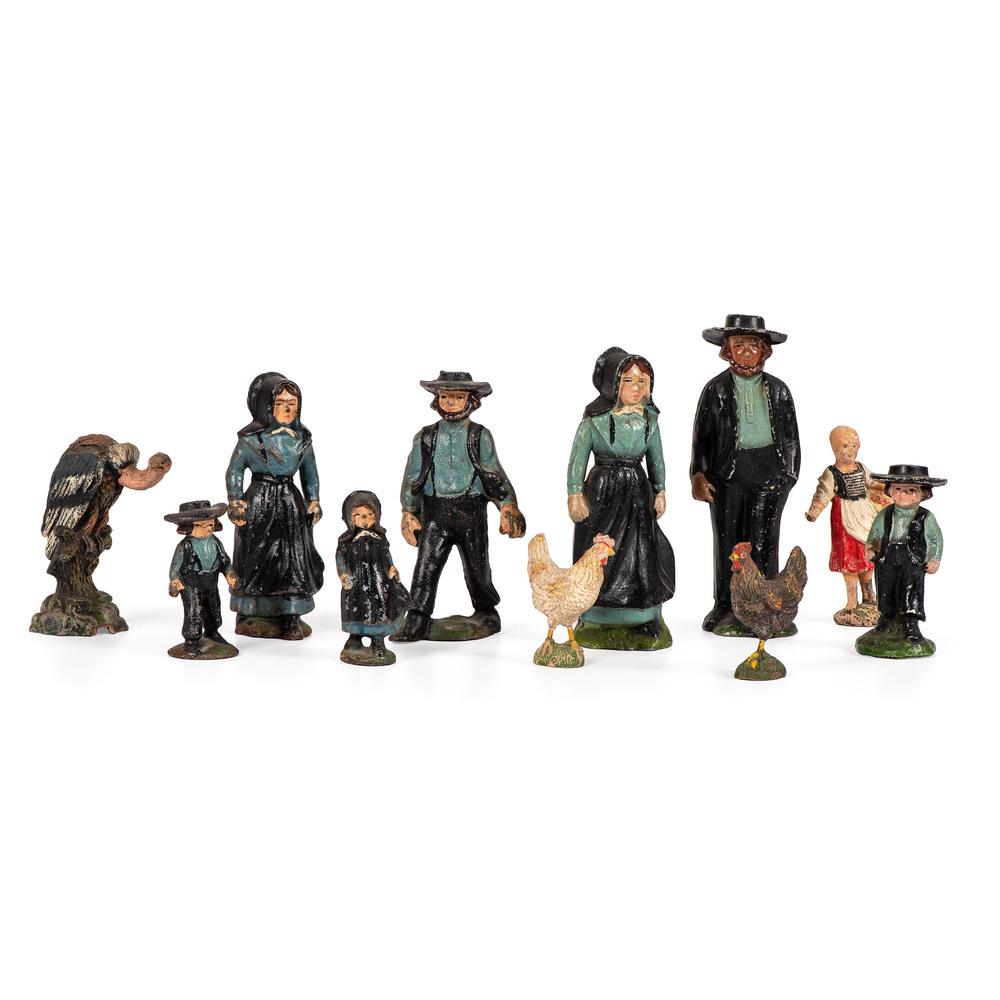 Eleven Toy Figurines, Including Seven Cast Iron Amish: Eleven Toy Figurines, Including Seven Cast Iron Amish Figures 20th Century also includes wooden and Elastolin animal figures. Height of largest 5 3/4 inches.