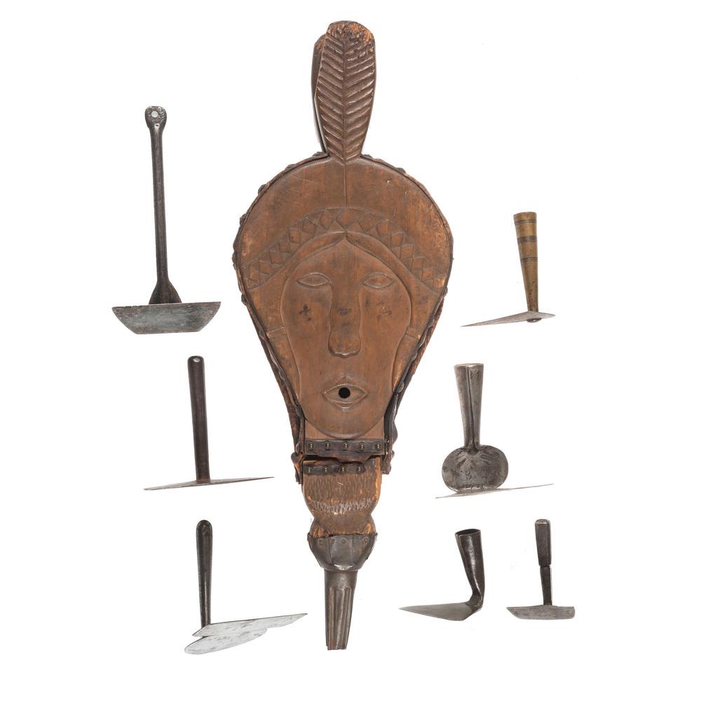 A Group of Hand-Forged Hearth Rakes and Figural Wooden: A Group of Hand-Forged Hearth Rakes and Figural Wooden Bellows 19th/20th Century the bellows relief-carved with the visage of a plumed Native American. Length of largest 7 3/8 inches.