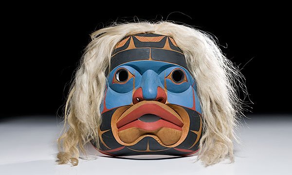 Alkuna Mask by Don Lelooska, : Alkuna Mask by Don Lelooska, third quarter 20th century with full, rounded features; long blond horsehair; signed on back, length 15" x width 14" From the Collection of Ken MacRae