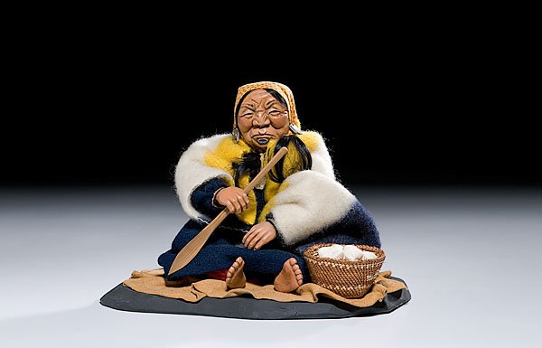Nootka Clamdigger by Shona Hah, : Nootka Clamdigger by Shona Hah, third quarter 20th century with abalone shell earrings and labret; sea shells held within basket; signed on base, height 9.25". From the Collection of Ken MacRae
