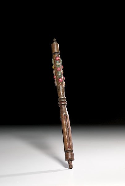Plains Pipe Stem Inlaid with Carved Polychrome Bea: Plains Pipe Stem Inlaid with Carved Polychrome Beads, late 19th century rounded form with carved wooden beads painted in colors of yellow, blue, pink, and purple inset into stem with unknown mastic,