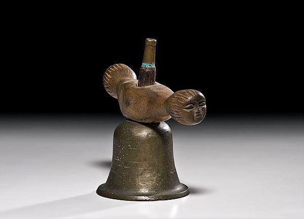 Bronze Bell with Folk Art Carved Wooden Yoke : Bronze Bell with Folk Art Carved Wooden Yoke early 20th century simple dome with yoke depicting human faces on ends, height 10" x diameter 10.5". Collected on the Seneca Indian Reservation in West