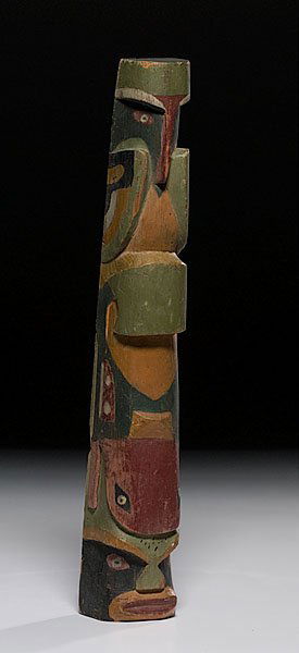 Carved Wooden Totem Pole with Bold Animals and Hum: Carved Wooden Totem Pole with Bold Animals and Human Face, second quarter 20th centuryat base. Pole paiointed in colors of old gold, green, red, black, and white, height 18". Pole with old numbers o