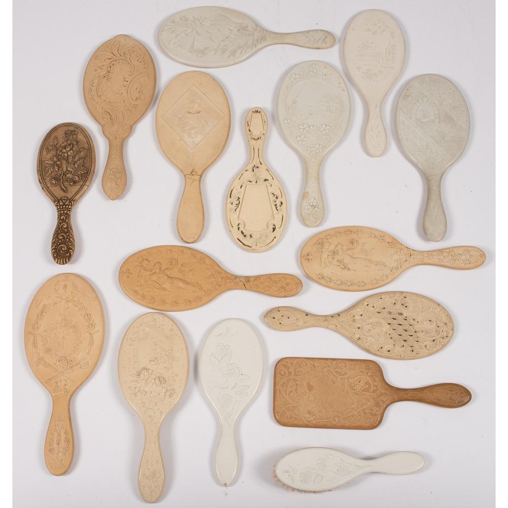 A Group of Ivory-Colored Thermoplastic Hand Mirrors: includes fifteen mirrors and one hairbrush. Length of largest 10 inches. Provenance: Marvin Lieber Collection of Early Photographica