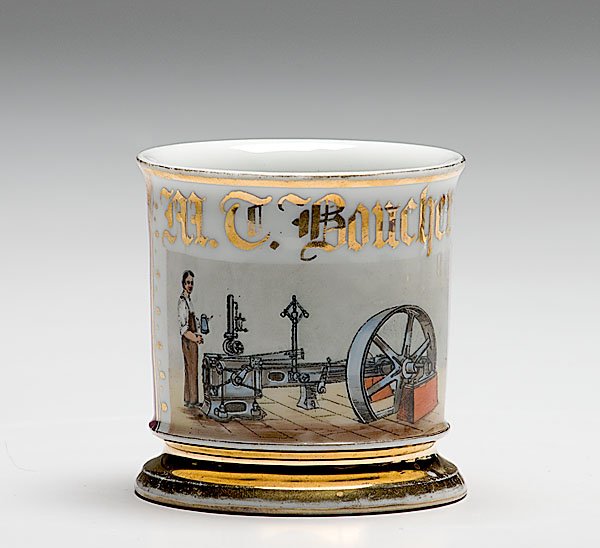 Unusually Fine Steam Mechanic Occupational Shaving : Unusually Fine Steam Mechanic Occupational Shaving Mug, porcelain, with polychrome painted scene of mechanic working on steam engine with oil can in hand. With pink monochrome wrap. Gilt name M.C. B