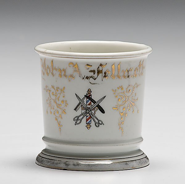 Barber's Occupational Shaving Mug, : Barber's Occupational Shaving Mug, porcelain, with polychrome painted scene of crossed barber scissors over shaving mug, shaving razor, and striped barber pole. Gilt name John A. Hellmeth with Limog