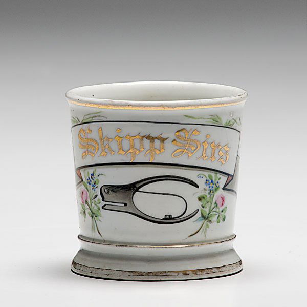 Occupational Shaving Mug with Ticket Punch, : Occupational Shaving Mug with Ticket Punch, porcelain, with polychrome painted scene of a ticket punching device and floral pattern border. Gilt name Skipp Sirs. With 280B marking on underside of ba