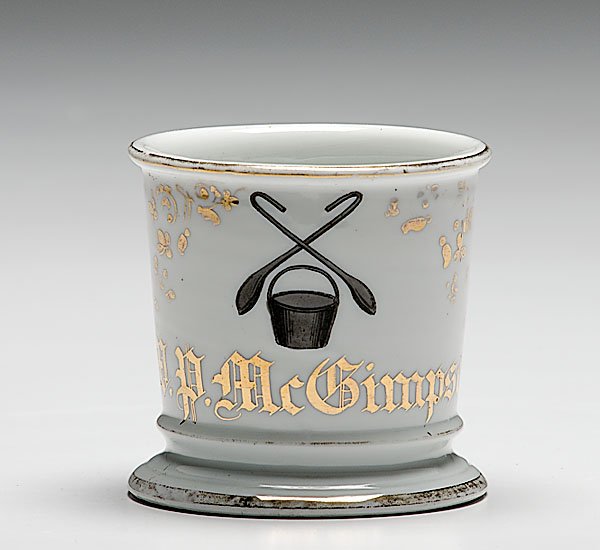 Iron Puddler Occupational Shaving Mug : Iron Puddler Occupational Shaving Mug porcelain, with polychrome painted scene of an iron pot with crossed iron spoons above. Gilt name W.P. McGimpsey. With Austrian maker's mark on underside of bas