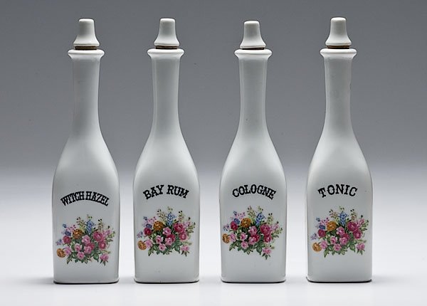 Group of Floral Painted Porcelain Barber Bottles, : Group of Floral Painted Porcelain Barber Bottles, lot of four painted porcelain barber bottles reading Tonic, Cologne, Bay Rum, and Witch Hazel over arrangement of flowers. Each is 10" tall with por