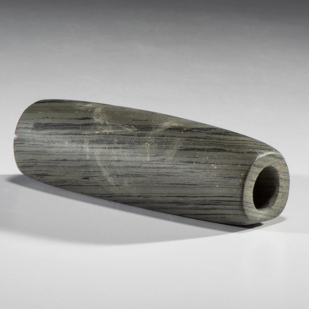 A Slate Tube Bannerstone, 3-3/8 in.: Middle - Late Archaic Period, 8000-1000 B.C. Southern Kentucky length 3-3/8 in. Collection History: Gerber Collection Number: AG.B33