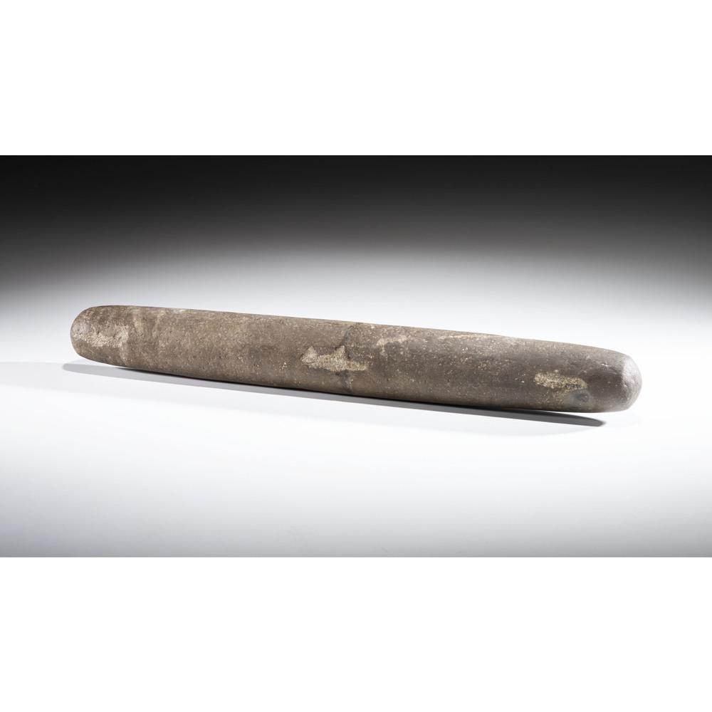 A Large Roller Pestle, 21-1/2 in.: Archaic Period, 8000-500 B.C. Broken in half and repaired. length 21-1/2 in. Published: Gerber, Art, The Art Gerber Story, 2007, pg. 167, fig. 107