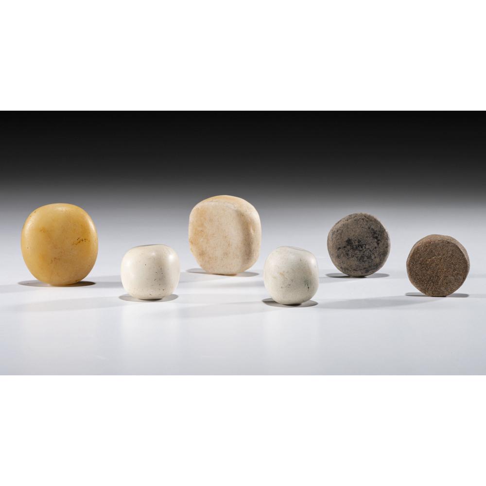 Six Game Stones, Largest 1-1/2 in.: Archaic - Woodland Period, 8000 B.C. - A.D. 1200 Tennessee [AG.H104] lot of 6, largest diameter 1-1/2 in. Collection History: Gerber Collection Numbers: AG.H84 & AG.H104