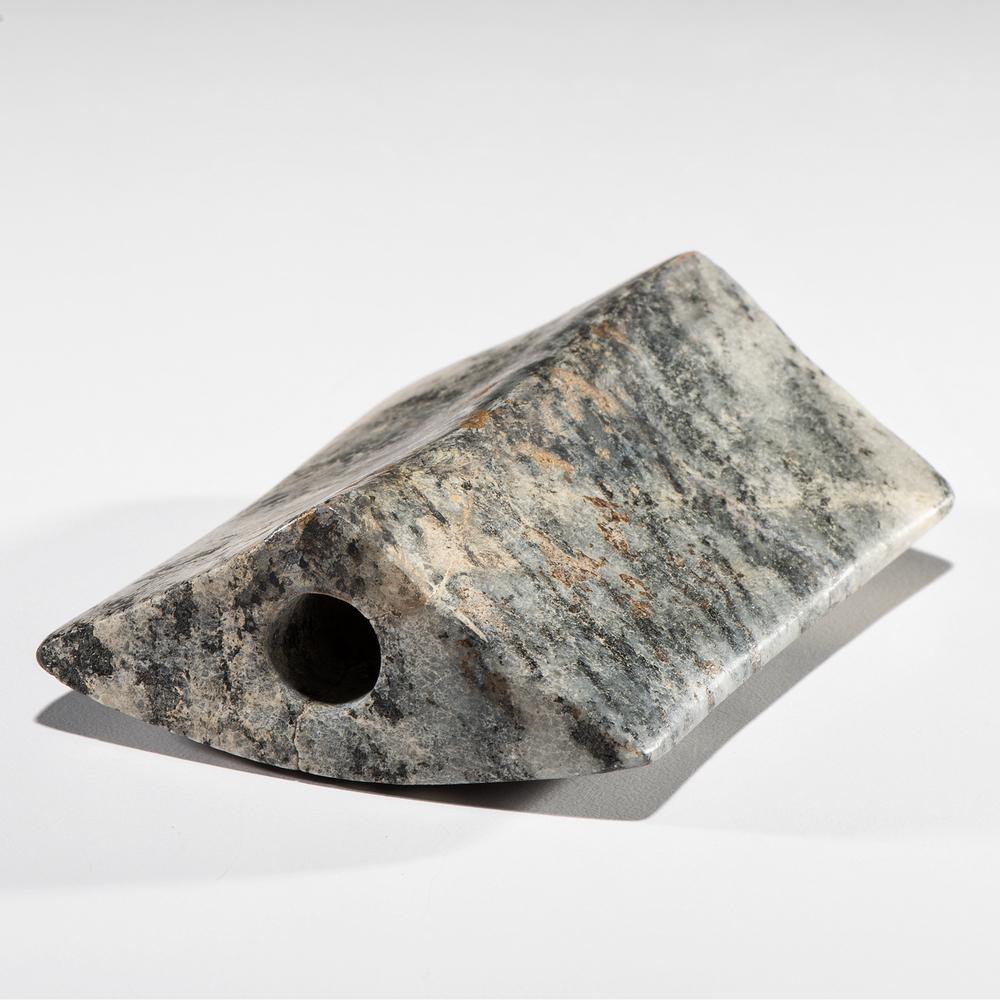 A Granite Saddle Bannerstone, 3-1/2 in.: Archaic Period, 8000-500 B.C. Pond River, Kentucky Killed and restored length 3-1/2 in. Collection History: Gerber Collection Number: AG.B71 Found by Floyd Stewart.