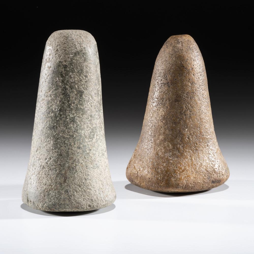 A Pair of Quartz and Granite Bell Pestles, Largest 6: Archaic - Woodland Period, 8000 B.C. - A.D. 1200 lot of 2, longest 6 in. Collection History: Gerber Collection Number: AG.H153
