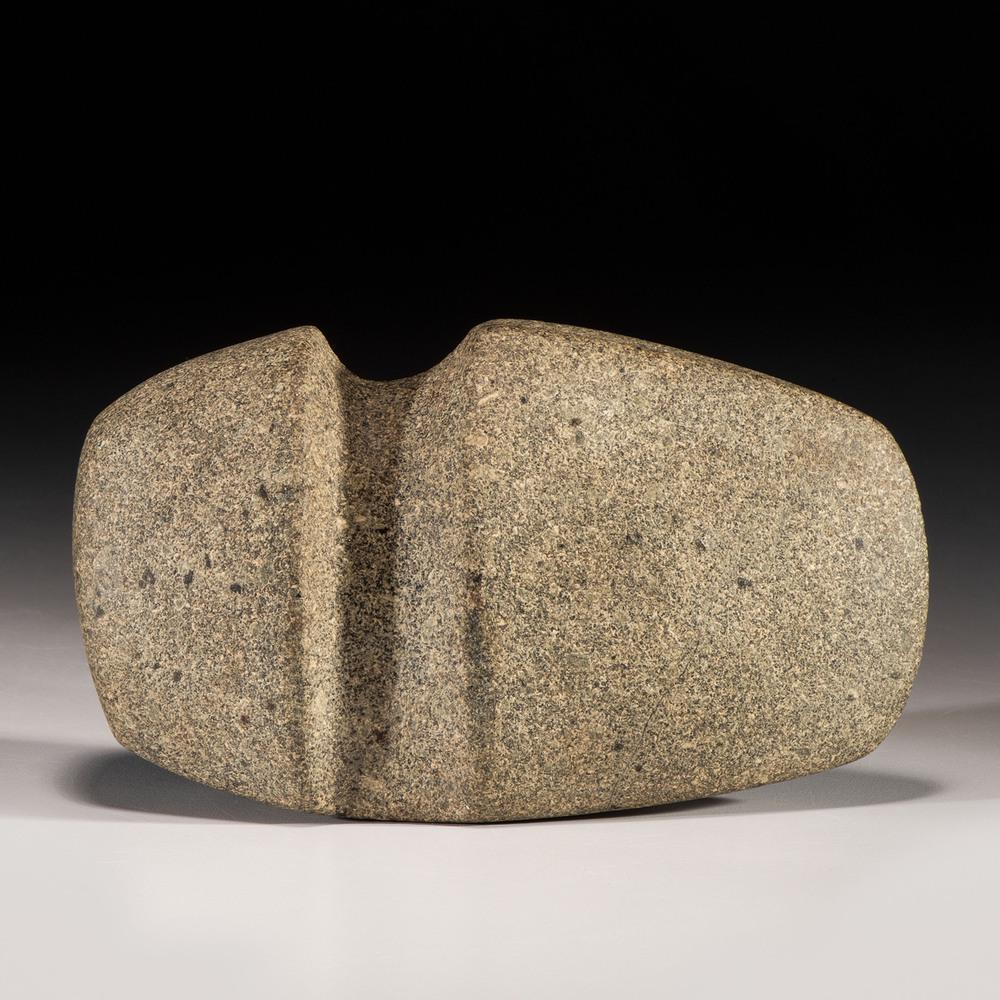 A Granite 3/4 Groove Fluted Axe, 6 in.: Late Archaic Period, 4000-1000 B.C. length 6 in. Collection History: Gerber Collection Number: AG.H129 Published:Gerber, Art, The Art Gerber Story, 2007, pg. 340, fig. 0.280