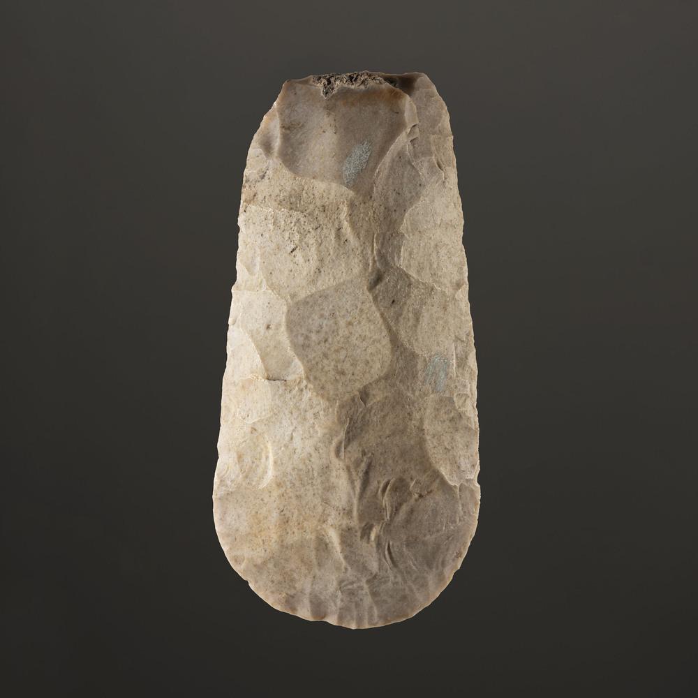 A Polished Flint Hoe, 7-1/4 in.: Mississippian Culture, Late Prehistoric Period, A.D. 1000-1500 length 7-1/4 in. This hoe has excellent bit polish. Collection History: Gerber Collection Number: AG.715