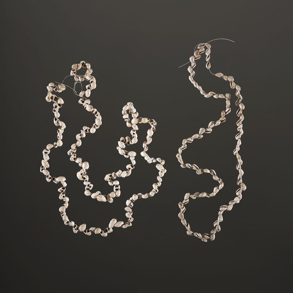 A Pair of Strung Shell Beads, Longest Strand 20 in.: Woodland Period, 800 B.C. - A.D. 1200 lot of 2, longest 20 in. Collection History: Gerber Collection Numbers: AG.SB229 & AG.SB228
