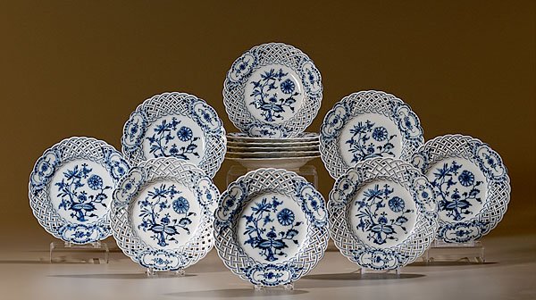 Meissen "Blue Onion" Pierced Plates, : Meissen "Blue Onion" Pierced Plates, Continental, early 20th century. Thirteen plates in the "Blue Onion" pattern, with underglaze blue crossed swords mark; 8" diameter.