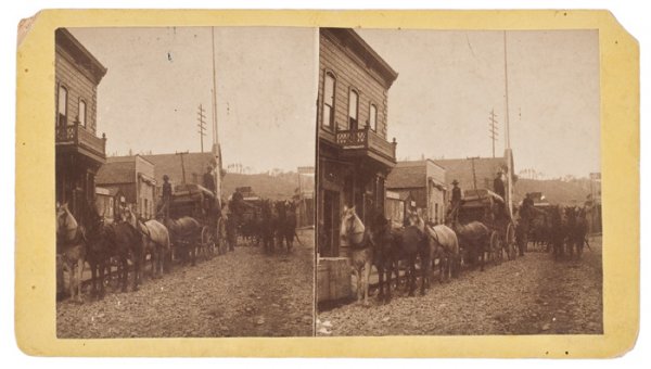 An Exceptional Stereoview of Stagecoaches at Deadw: An Exceptional Stereoview of Stagecoaches at Deadwood, Dakota Territory, on yellow, cabinet-sized mount, with imprint of the Black Hills View Company. Sherman St. Deadwood, Dakota. Terrific street-l