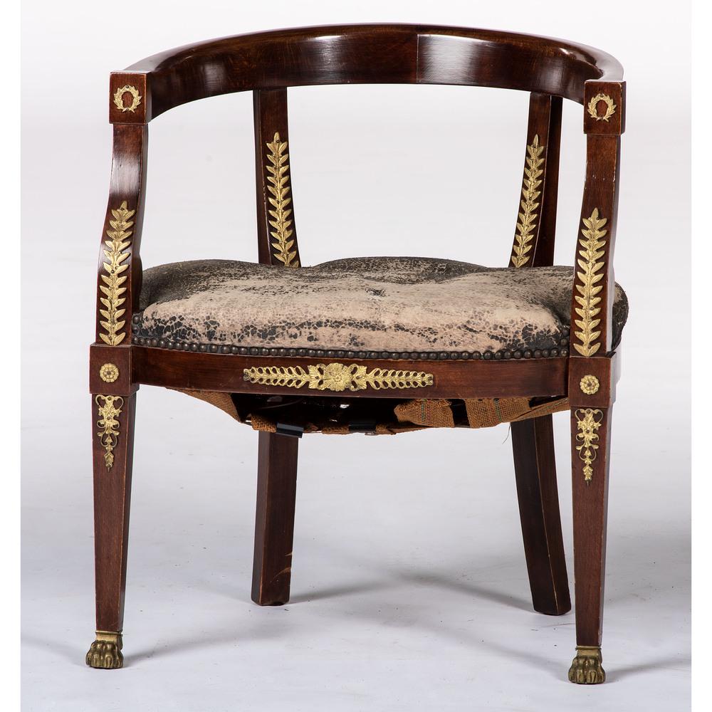 An Empire-style Gilt Metal Mounted Mahogany Bergere: Continental, Late 19th/Early 20th Century Height 28 inches.