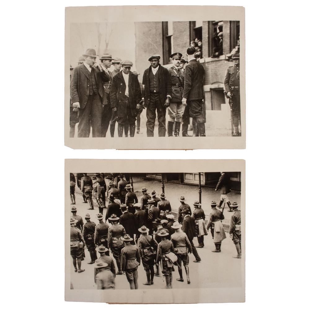 [CRIME & PUNISHMENT]. A group of two press photographs: [CRIME & PUNISHMENT]. A group of two press photographs of Federal troops protecting African American defendants from lynching, comprising: FLEMING, Bunyan (ca 1895-1927). BARD, Nathan (ca 1896-1927).�