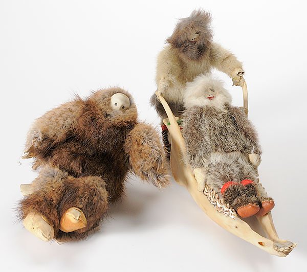 Eskimo Doll by Mary Etok, PLUS, : Eskimo Doll by Mary Etok, PLUS, lot of 2, including one doll by Mary Etok of a man with carved bone head and eyes of baleen, seated on a cut deer antler, height 5"; AND another two dolls, one riding