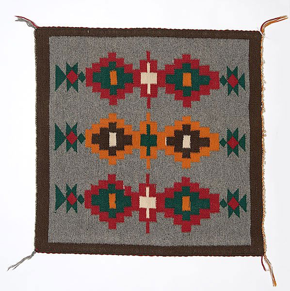 Navajo Regional Sampler : Navajo Regional Sampler woven of commercially spun wool with a pleasing bright pattern of stacked stepped diamonds, 22" x 22".