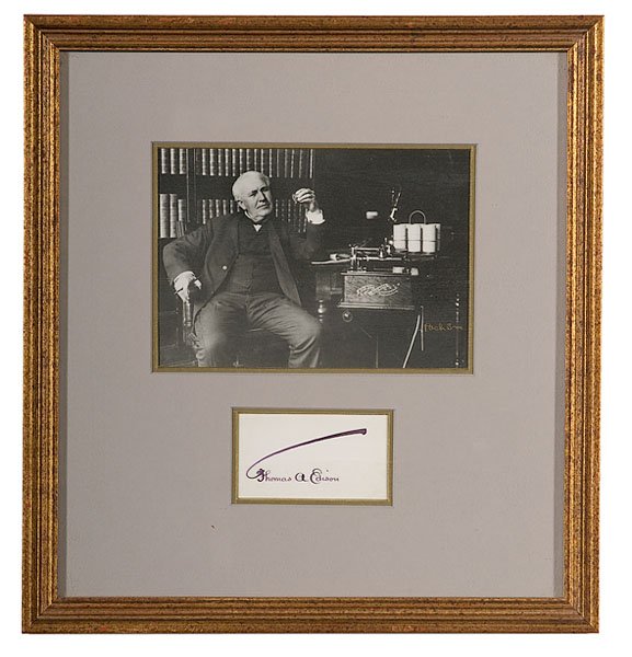 Thomas Edison Clipped Signature, Plus, : Thomas Edison Clipped Signature, Plus, lot includes Thomas A. Edison clipped signature, 1.75 x 3.25", accompanied by a Pach Bros photograph of Edison sitting next to the Edison Business Phonograph, 