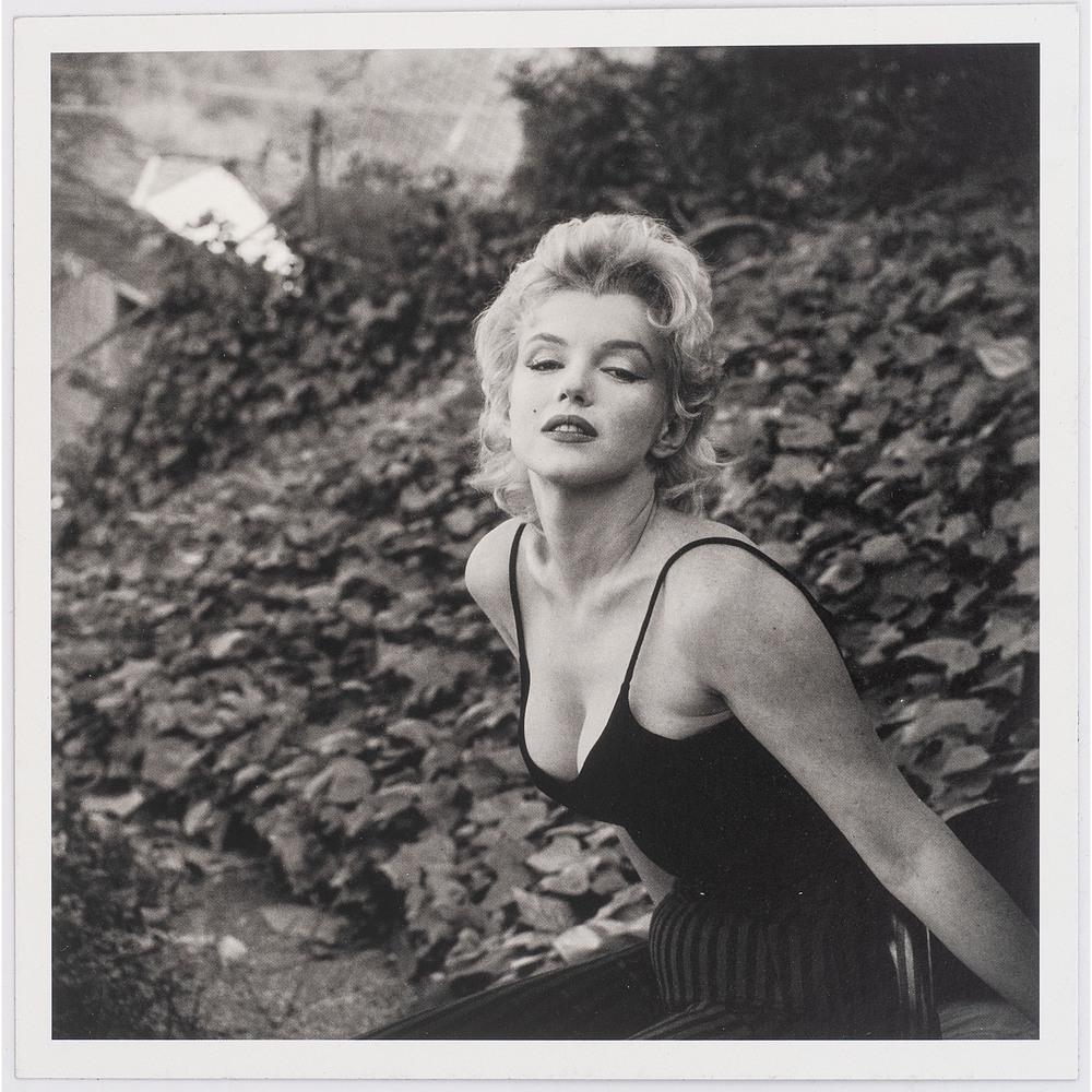 [AFRICAN AMERICANA -- PHOTOGRAPHY]. PARKS, Gordon: [AFRICAN AMERICANA -- PHOTOGRAPHY]. PARKS, Gordon (1912-2006), photographer. Outdoor portrait of Marilyn Monroe. N.p., [ca 1959]. 7 3/4 x 7 3/4 in. photograph mounted to black cardstock (light impress