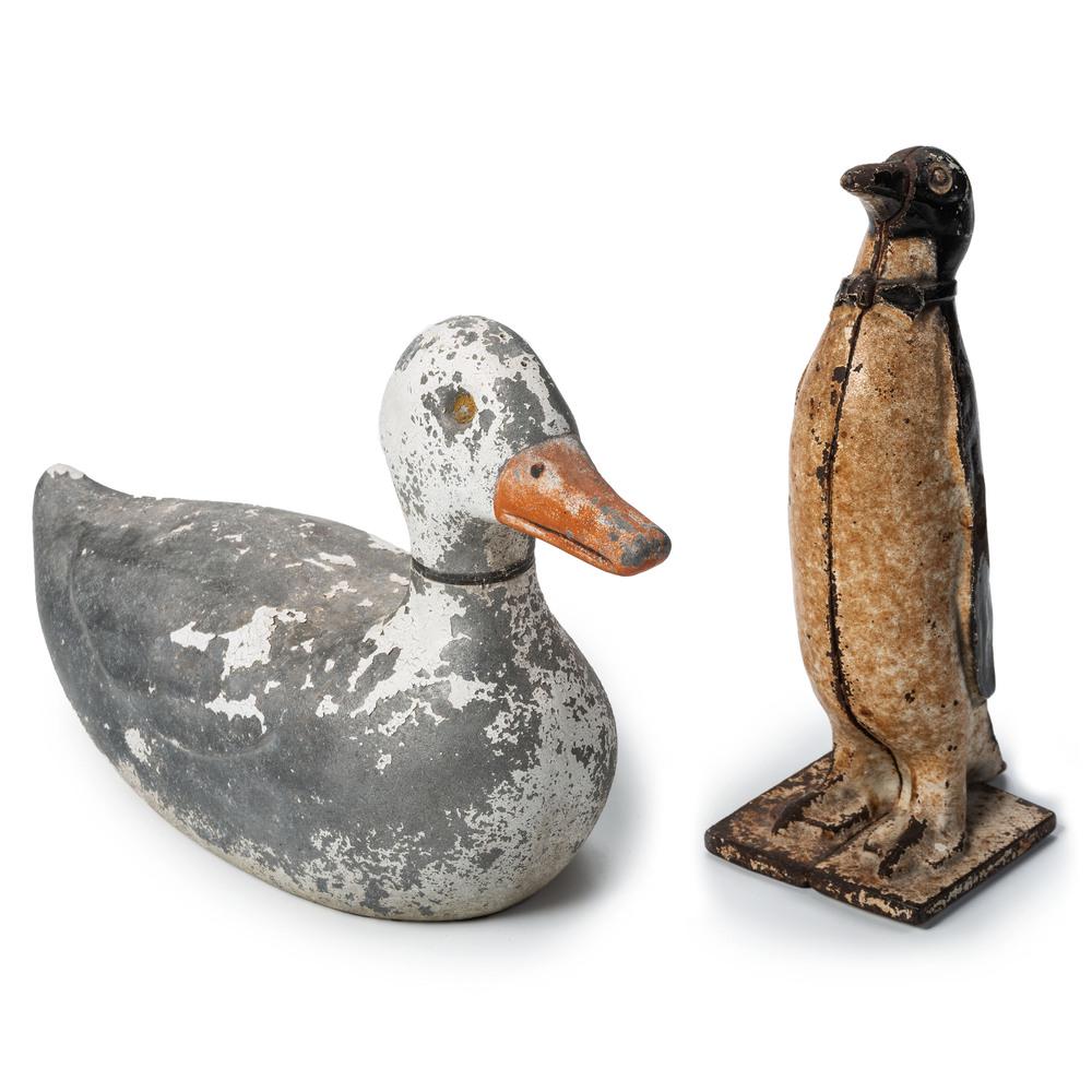 Two Cast Metal Figural Articles: Two Cast Metal Figural Articles comprising an iron penguin doorstop and a heavy aluminum duck form sprinkler. Height of largest 10 inches. Property from the Collection of Paul M. Bentley, Oostburg, WI