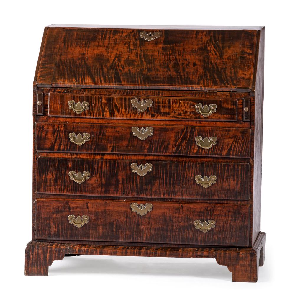 A Chippendale Figured Maple Slant Front Desk, New: A Chippendale Figured Maple Slant Front Desk, New England Late 18th Century Height 40 x width 36 x depth 18 inches. Provenance: Bernie Plum Antiques Property from the Collection of Mark and Patricia M
