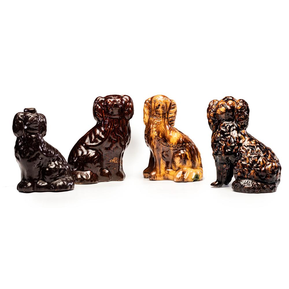 Four Rockingham and Albany Glaze Spaniel Figures: Four Rockingham and Albany Glaze Spaniel Figures 19th Century Height of largest 9 1/4 inches. Property from the Estate of James A. Sanders, Evansville, IndianaHindman is honored to present property fr