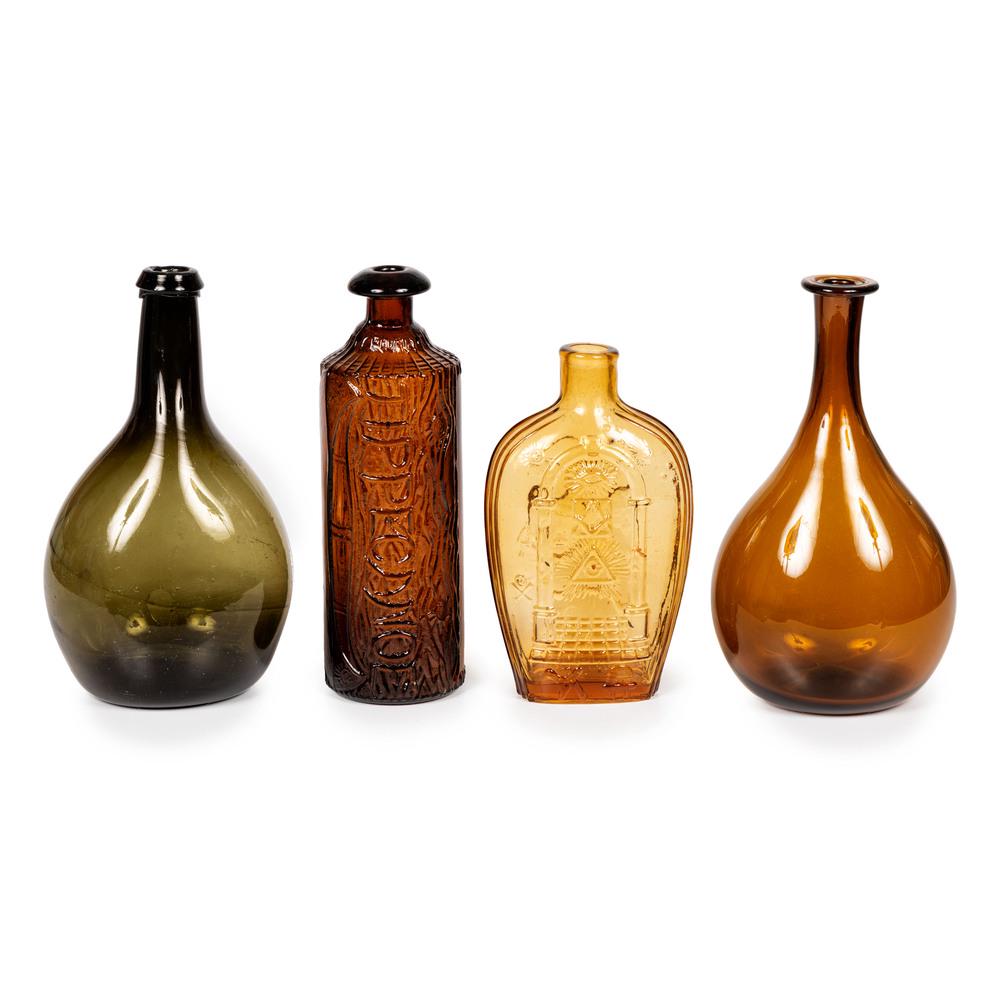 Four Blown and Molded Colored Glass Bottles: Four Blown and Molded Colored Glass Bottles 19th/20th Century including two blown glass club bottles, a Tippecanoe bottle and a contemporary Masonic molded flask. Height of largest 9 inches. Property