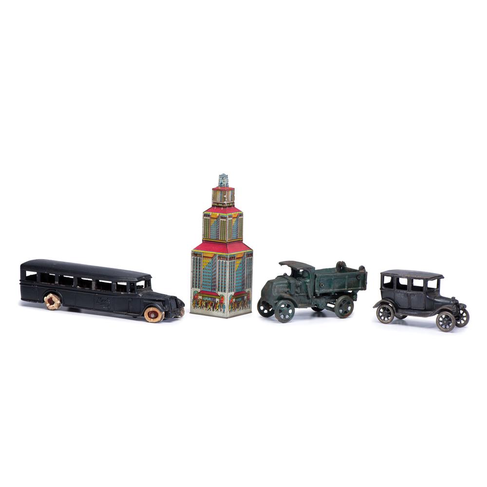 Three Cast Iron and Painted Toy Cars: Three Cast Iron and Painted Toy Cars American, 20th Century includes one Mack 6 car, one unmarked car, and one truck. together with a tin lithograph-decorated skyscraper toy. Height of largest 10 3/4