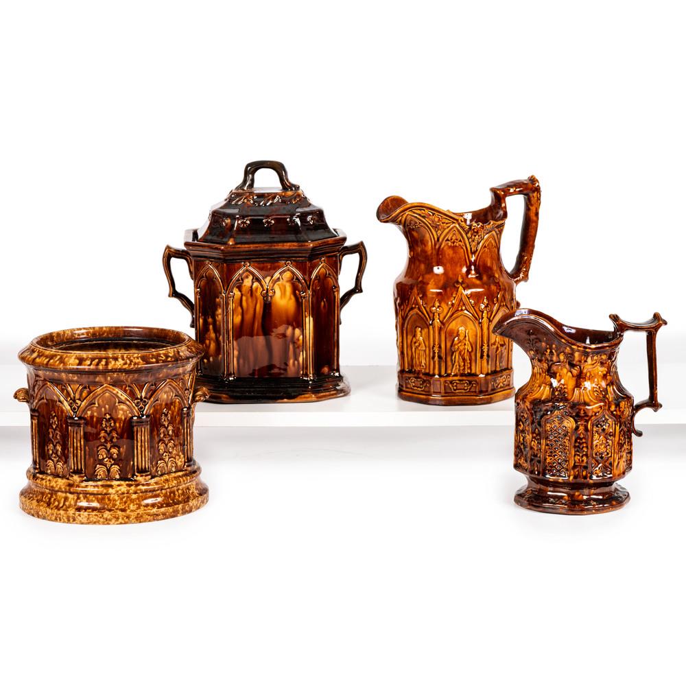 Four Rockingham Glaze Vessels with Gothic Arch: Four Rockingham Glaze Vessels with Gothic Arch Decoration 19th Century including two pitchers and two jars. Height of largest 11 inches. Property from the Estate of James A. Sanders, Evansville, India