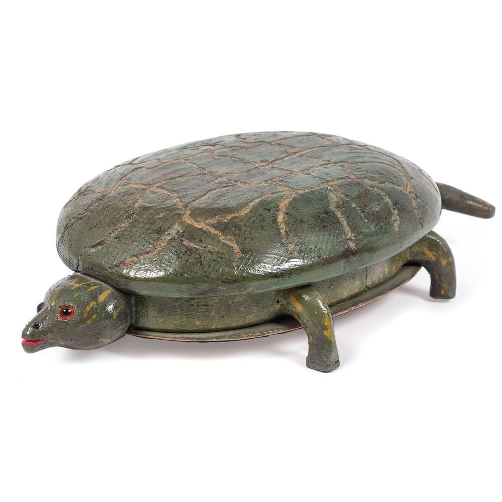 A Folk Art Carved and Painted Turtle: A Folk Art Carved and Painted Turtle Attributed to Miles Smith, Marine City, Michigan, Second Half 20th Century with carved details to shell and having glass eyes. Length 15 inches. Property of the la