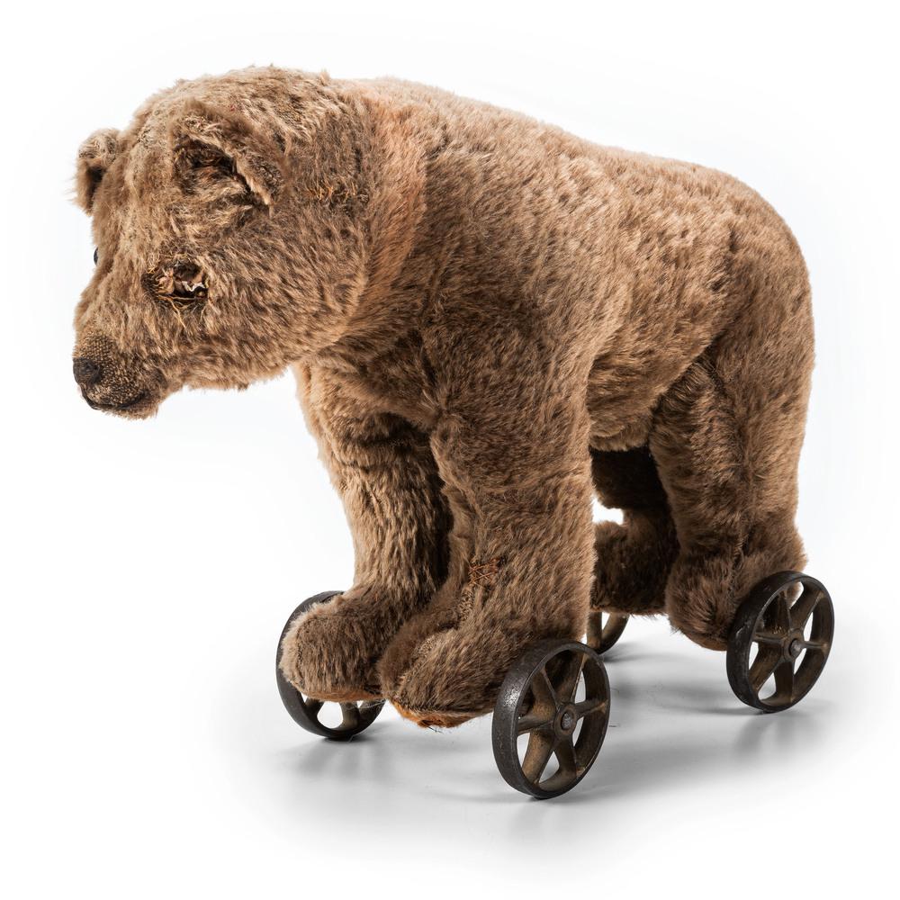 A Stuffed Bear Pull Toy: A Stuffed Bear Pull Toy Possibly Steiff, 20th Century Height 12 x length 16 inches. Property of the late Karen Tosterud, Bellaire, Michigan We are pleased to offer the collection of Karen Renae Toster