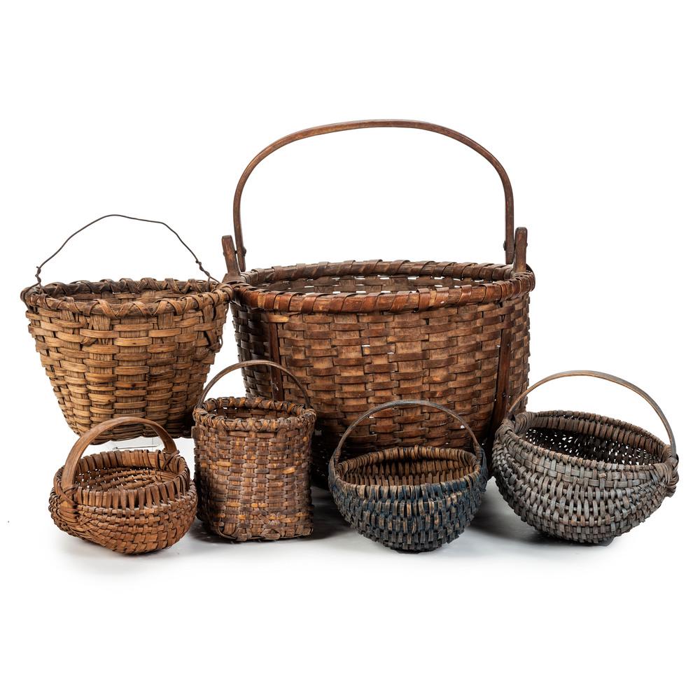 Six Split Oak Baskets with Handles: Six Split Oak Baskets with Handles including a large basket with swing handle, three buttocks baskets and two berry baskets. large basket handle with obscured incised mark. Height of largest 11 x diam