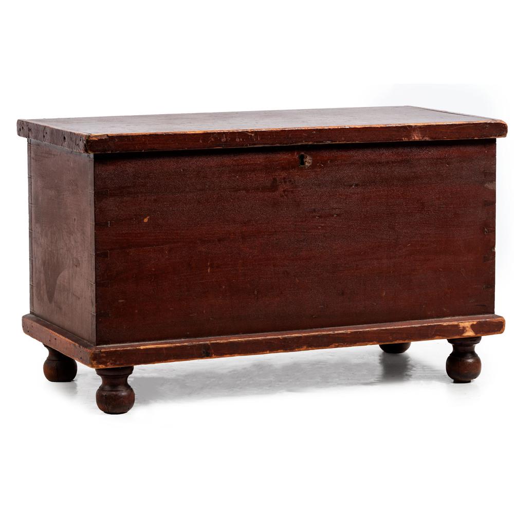 A Federal Red-Stained Poplar and Pine Diminutive: A Federal Red-Stained Poplar and Pine Diminutive Blanket Chest, Circa 1850 Likely Pennsylvania appears to retain its original till and till cover. Height 15 x width 25 x depth 12 1/4 inches.