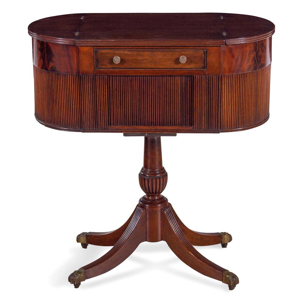 A Classical Mahogany Work Table in the Manner of Duncan: A Classical Mahogany Work Table in the Manner of Duncan Phyfe 19th Century having two side compartments and a single drawer over a tambour door. Height 31 x width 28 x depth 14 1/2 inches.