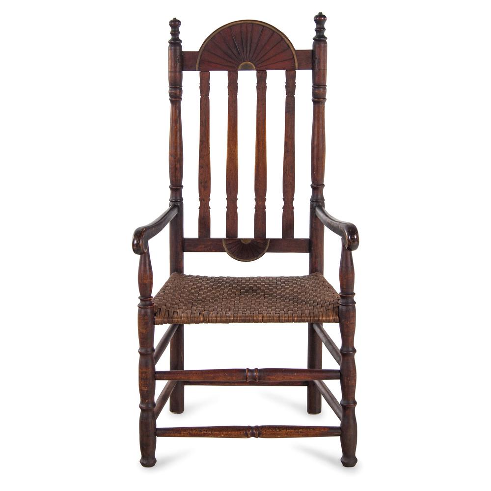 A William and Mary Style Red and Gilt Paint Decorated: A William and Mary Style Red and Gilt Paint Decorated Bannister Back Woven Splint Seat Armchair, New England 19th Century and Later retains traces a dark, historic surface. Height 47 3/4 inches. Prope