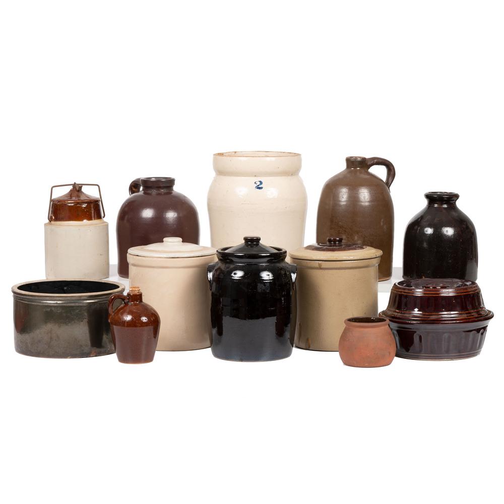 Twelve Stoneware Crocks, Jugs, and Lidded Vessels: Twelve Stoneware Crocks, Jugs, and Lidded Vessels American, 19th/20th Century including a small stoneware jug with impressed The Roycroft Shops / Aurora N.Y. to underside, a redware jar with impress